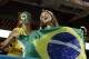 Brazilian soccer fans wave a flag before an international friendly soccer match between Brazil and Colombia, Friday, Sept. 5, 2014, in Miami Gardens, Fla. (AP Photo/Lynne Sladky)