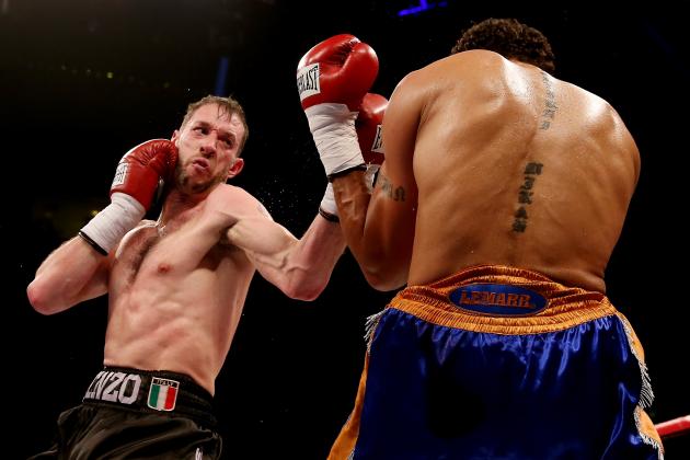 LIVERPOOL, ENGLAND - DECEMBER 07: Enzo Maccarinelli (L) in action with Courtney Fry during their Commonwealth light Heavyweight bout at Liverpool Echo Arena on December 7, 2013 in Liverpool, England. (Photo by Scott Heavey/Getty Images)