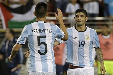 Argentina's Matias Kranevitter (5) and Ever Banega (19) celebrate after a Copa America Centenario Group A soccer match against Chile at Levi's Stadium in Santa Clara, Calif., Monday June 6, 2016. Argentina won 2-1. (AP Photo/Jeff Chiu)