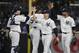 New York Yankees catcher Brian McCann (34) and relief pitcher Aroldis Chapman (54) celebrate with Jacoby Ellsbury, and Aaron Hicks, right, after a baseball game against the Los Angeles Angels on Thursday, June 9, 2016, in New York. The Yankees won 6-3. (AP Photo/Frank Franklin II)
