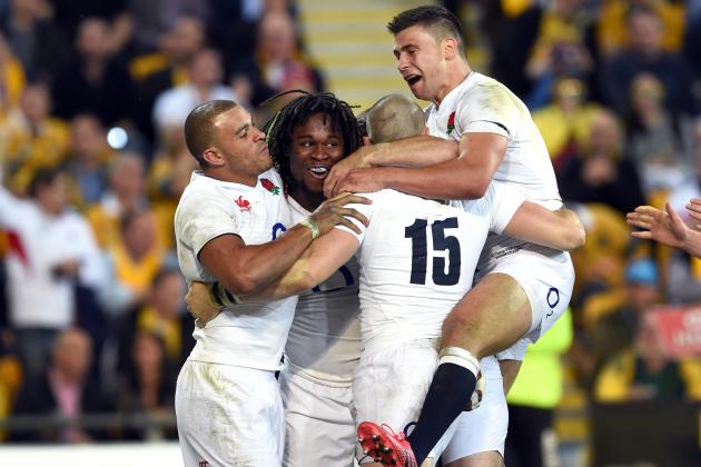 England's Marland Yarde (2/L) is congratulated by teammates after scoring against Australian Wallabies in their international rugby union match played in Brisbane on June 11, 2016. / AFP / WILLIAM WEST / IMAGE RESTRICTED TO EDITORIAL USE - STRICTLY NO COMMERCIAL USE
        (Photo credit should read WILLIAM WEST/AFP/Getty Images)