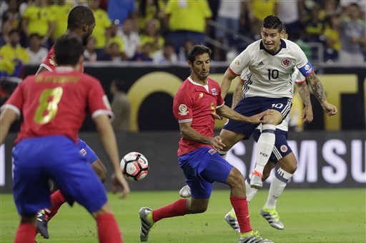 Colombia's James Rodriguez (10) takes a shot on goal past Costa Rica's Celso Borges (5) during a Copa America Centenario group A soccer match Saturday, June 11, 2016, in Houston. (AP Photo/David J. Phillip)