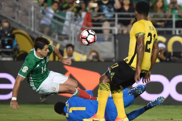Mexico's Javier 'Chicharito' Hernandez (L) vies fr the ball with Jamaica's goalie Andre Blake and Jamaica's Jermaine Taylor during the Copa America Centenario football match in Pasadena, California, United States, on June 9, 2016.  / AFP / Mark Ralston        (Photo credit should read MARK RALSTON/AFP/Getty Images)