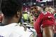 FILE - In this Oct. 26, 2015, file photo, Arizona Cardinals' Dwight Freeney (54) talks with Baltimore Ravens' Shareece Wright, left, after an NFL football game, in Glendale, Ariz. Freeney was contemplating retirement in October when he took a call from the Arizona Cardinals and was coaxed back to the NFL. (AP Photo/Ross D. Franklin, File)