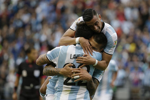 Argentina's Victor Cuesta, center, is congratulated by Ezequiel Lavezzi, front, and Ramiro Funes Mori after scoring his side's third goal against Bolivia during a Copa America Centenario Group D soccer match, Tuesday, June 14, 2016, at CenturyLink Field in Seattle. (AP Photo/Elaine Thompson)