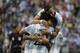 Argentina's Victor Cuesta, center, is congratulated by Ezequiel Lavezzi, front, and Ramiro Funes Mori after scoring his side's third goal against Bolivia during a Copa America Centenario Group D soccer match, Tuesday, June 14, 2016, at CenturyLink Field in Seattle. (AP Photo/Elaine Thompson)