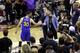 CLEVELAND, OH - JUNE 16: Stephen Curry #30 of the Golden State Warriors shakes hands with Andrew Forbes, son of Cavaliers minority owner Nate Forbes, after throwing his mouthguard in the fourth quarter against the Cleveland Cavaliers in Game 6 of the 2016 NBA Finals at Quicken Loans Arena on June 16, 2016 in Cleveland, Ohio. NOTE TO USER: User expressly acknowledges and agrees that, by downloading and or using this photograph, User is consenting to the terms and conditions of the Getty Images License Agreement. (Photo by Ronald Martinez/Getty Images)