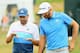 Sergio Garcia and Dustin Johnson, sharing thoughts in the first round of the U.S. Open. Dustin Johnson has been a crowd favorite despite never winning a major.