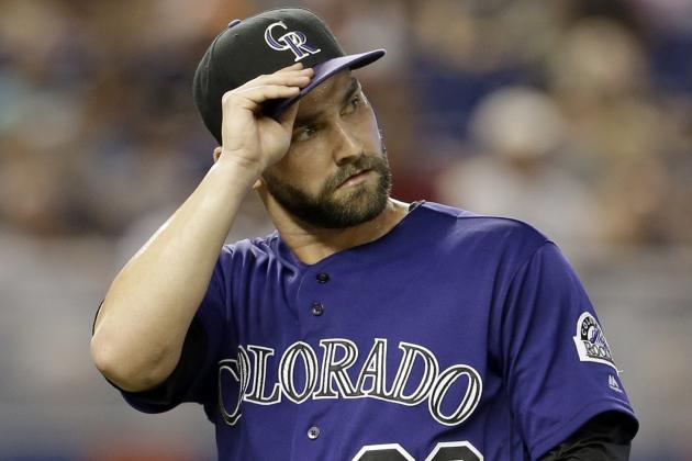 Colorado Rockies' Tyler Chatwood heads to the dugout at the end of the first inning of a baseball game against the Miami Marlins, Saturday, June 18, 2016, in Miami. (AP Photo/Alan Diaz)