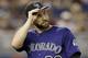Colorado Rockies' Tyler Chatwood heads to the dugout at the end of the first inning of a baseball game against the Miami Marlins, Saturday, June 18, 2016, in Miami. (AP Photo/Alan Diaz)