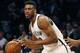 Brooklyn Nets forward Thaddeus Young (30) dribbles in the first half of an NBA basketball game, Monday, Jan. 11, 2016, in New York. (AP Photo/Kathy Willens)