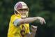 Washington Redskins starting quarterback Kirk Cousins (8), grimaces as he throws the ball during the NFL football team's minicamp at the Redskins Park in Ashburn, Va., Wednesday, June 15, 2016. (AP Photo/Manuel Balce Ceneta)
