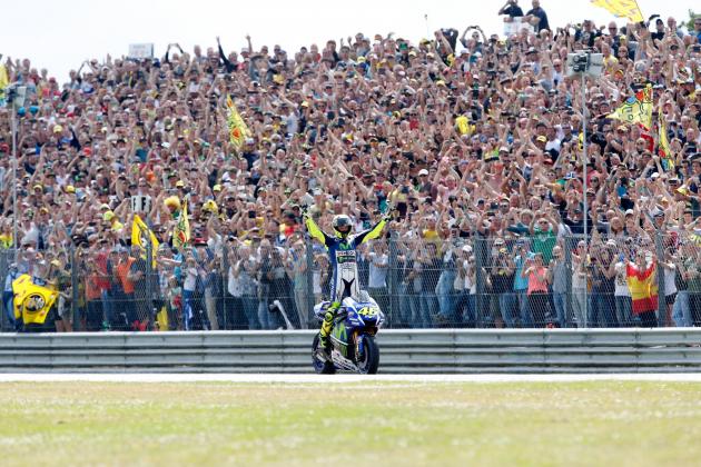 Italian MotoGP rider Valentino Rossi of the Movistar Yamaha MotoGP team celebrates after winning the Motorcycling Grand Prix TT Assen at the TT Circuit in Assen on June 27, 2015.  AFP PHOTO / ANP / BAS CZERWINSKI  ***NETHERLANDS OUT***        (Photo credit should read BAS CZERWINSKI/AFP/Getty Images)