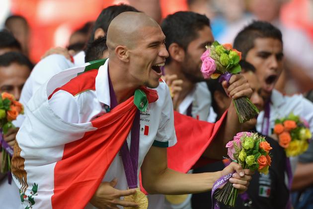 LONDON, ENGLAND - AUGUST 11:  Jorge Enriquez of Mexico celebrates winning the gold medal after the Men's Football Final between Brazil and Mexico on Day 15 of the London 2012 Olympic Games at Wembley Stadium on August 11, 2012 in London, England.  (Photo by Jeff J Mitchell/Getty Images)