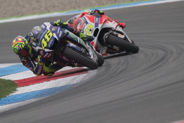 ASSEN, NETHERLANDS - JUNE 25:  Valentino Rossi of Italy and Movistar Yamaha MotoGP leads Andrea Iannone of Italy and Ducati Team during the qualifying practice during the at MotoGP Netherlands - Qualifying on June 25, 2016 in Assen, Netherlands.  (Photo by Mirco Lazzari gp/Getty Images)