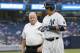 New York Yankees' Carlos Beltran, right, leaves the game with trainer Steve Donohue after an injury while running to first base on a single during the first inning of a baseball game against the Texas Rangers, in New York, Tuesday, June 28, 2016. (AP Photo/Kathy Willens)