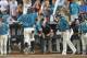 OMAHA, NE - JUNE 28: Base runner Zach Remillard #7 of the Coastal Carolina Chanticleers reacts as he scores against the Arizona Wildcats in the seventh inning during game two of the College World Series Championship Series on June 28, 2016 at TD Ameritrade Park in Omaha, Nebraska. The Chanticleers won 5-4. (Photo by Peter Aiken/Getty Images)