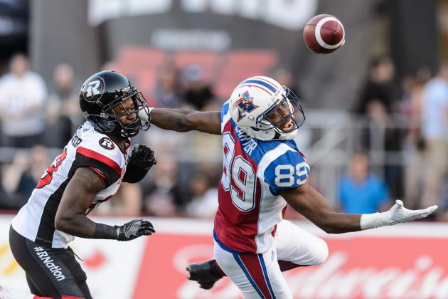 MONTREAL, QC - JUNE 30: Wide receiver Duron Carter #89 of the Montreal Alouettes misses a pass with defensive back Forrest Hightower #23 of the Ottawa Redblacks close behind during the CFL game at Percival Molson Stadium on June 30, 2016 in Montreal, Quebec, Canada. (Photo by Minas Panagiotakis/Getty Images)