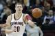 Cleveland Cavaliers' Timofey Mozgov, from Russia, passes against the Indiana Pacers in the first half of an NBA basketball game Monday, Feb. 29, 2016, in Cleveland. (AP Photo/Tony Dejak)
