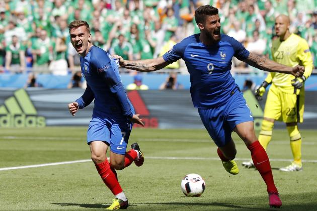 France's Antoine Griezmann, left, celebrates with his teammate Olivier Giroud after scoring his side's first goal, during the Euro 2016 round of 16 soccer match between France and Ireland, at the Grand Stade in Decines-­Charpieu, near Lyon, France, Sunday, June 26, 2016. (AP Photo/Laurent Cipriani)