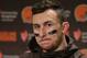FILE - In this Dec. 20, 2015, file photo, Cleveland Browns quarterback Johnny Manziel speaks with media members following the team's 30-13 loss to the Seattle Seahawks in an NFL football game, in Seattle. Manziel has been suspended for the first four games of next season for violating the NFL's substance-abuse policy.The suspension announced Thursday, June 30, 2016, is not related to the NFL's domestic violence policy, but the free agent quarterback would be subject to it if he signs with another team. (AP Photo/Scott Eklund, File)