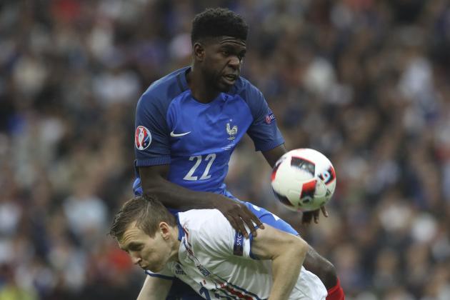 France's Samuel Umtiti, top, challenges for the ball with Iceland's Jon Dadi Bodvarsson during the Euro 2016 quarterfinal soccer match between France and Iceland, at the Stade de France in Saint-Denis, north of Paris, France, Sunday, July 3, 2016. (AP Photo/Petr David Josek)