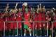 PARIS, FRANCE - JULY 10: Cristiano Ronaldo of Portugal (c) lifts the European Championship trophy after his side win 1-0 against France during the UEFA EURO 2016 Final match between Portugal and France at Stade de France on July 10, 2016 in Paris, France. (Photo by Matthias Hangst/Getty Images)