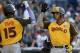 World Team's Yoan Moncada, of the Boston Red Sox, greets teammate Raimel Tapia, of the Colorado Rockies (15), after hitting a two-run home run against the U.S. Team during the eighth inning of the All-Star Futures baseball game, Sunday, July 10, 2016, in San Diego. (AP Photo/Lenny Ignelzi)