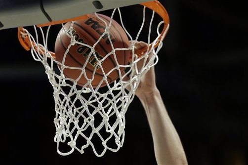 A Gonzaga player drops a ball in the basket during college basketball practice, Thursday, March 24, 2016, in Chicago. Gonzaga plays against Syracuse in a regional semifinal game in the NCAA Tournament on Friday. (AP Photo/Nam Y. Huh)