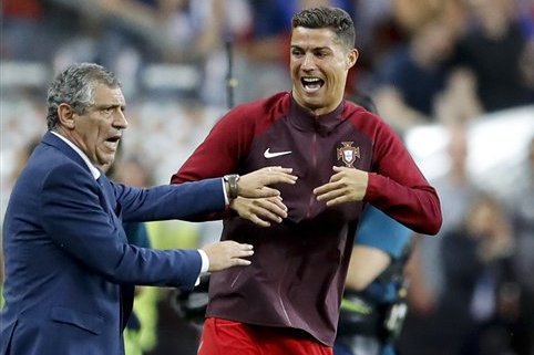 Portugal's Cristiano Ronaldo and Portugal coach Fernando Santos react moments before the end of the Euro 2016 final soccer match between Portugal and France at the Stade de France in Saint-Denis, north of Paris, Sunday, July 10, 2016. Portugal won 1-0. (AP Photo/Frank Augstein)