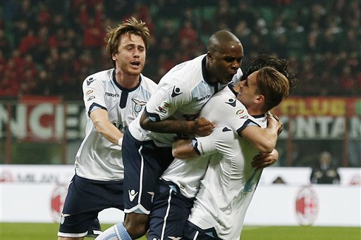 Lazio’s Marco Parolo, second from right, celebrates with his teammates after scoring during the Serie A soccer match between AC Milan and Lazio at the San Siro stadium in Milan, Italy, Sunday, March 20, 2016. (AP Photo/Antonio Calanni)