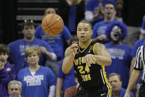 Southern Miss' Jonathan Mills passes the ball during the first half of an NCAA basketball game against Memphis in Memphis, Tenn., Saturday, Feb. 23, 2013. (AP Photo/Danny Johnston)