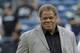 Oakland Raiders general manager Reggie McKenzie stands on the field before a preseason NFL football game against the Seattle Seahawks, Thursday, Sept. 3, 2015, in Seattle. (AP Photo/Elaine Thompson)