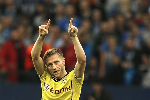 Dortmund's Jakub Blaszczykowski of Poland celebrates after scoring during the German first division Bundesliga soccer match between Schalke 04 and BvB Borussia Dortmund in Gelsenkirchen, Germany, Saturday, Oct. 26, 2013. (AP Photo/Frank Augstein)