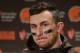 FILE - In this Dec. 20, 2015, file photo, Cleveland Browns quarterback Johnny Manziel speaks with media members following the team's 30-13 loss to the Seattle Seahawks in an NFL football game, in Seattle. Manziel has been suspended for the first four games of next season for violating the NFL's substance-abuse policy.The suspension announced Thursday, June 30, 2016, is not related to the NFL's domestic violence policy, but the free agent quarterback would be subject to it if he signs with another team. (AP Photo/Scott Eklund, File)
