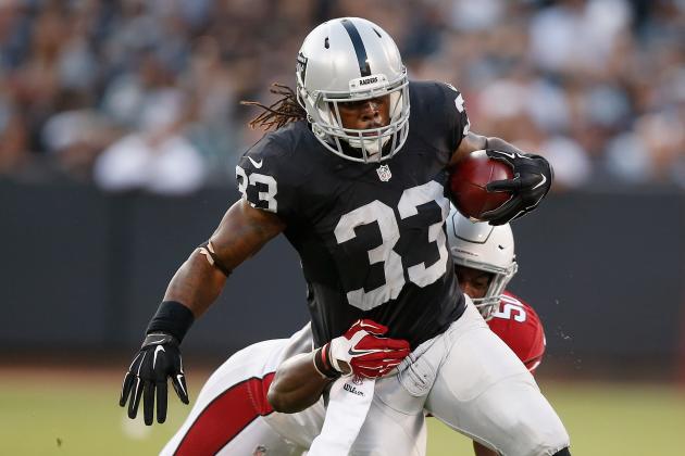 OAKLAND, CA - AUGUST 30:  Trent Richardson #33 of the Oakland Raiders is tackled by Gabe Martin #50 of the Arizona Cardinals at O.co Coliseum on August 30, 2015 in Oakland, California.  (Photo by Ezra Shaw/Getty Images)