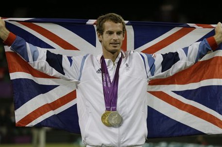 Andy Murray of Great Britain poses with his gold and silver medals in tennis at the All England Lawn Tennis Club in Wimbledon, London at the 2012 Summer Olympics, Sunday, Aug. 5, 2012. (AP Photo/Mark Humphrey)