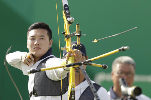 South Korea's Ku Bon-chan releases the arrow during the men's team archery competition at the Sambadrome venue during the 2016 Summer Olympics in Rio de Janeiro, Brazil, Saturday, Aug. 6, 2016.(AP Photo/Natacha Pisarenko)