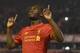 Liverpool's Christian Benteke celebrates after scoring his team's first goal during the English Premier League football match between Liverpool and Chelsea at Anfield in Liverpool, north west England on May 11, 2016. / AFP / PAUL ELLIS / RESTRICTED TO EDITORIAL USE. No use with unauthorized audio, video, data, fixture lists, club/league logos or 'live' services. Online in-match use limited to 75 images, no video emulation. No use in betting, games or single club/league/player publications. / (Photo credit should read PAUL ELLIS/AFP/Getty Images)