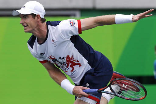 Andy Murray, of England, serves to Viktor Troicki, of Serbia, at the 2016 Summer Olympics in Rio de Janeiro, Brazil, Sunday, Aug. 7, 2016. (AP Photo/Charles Krupa)