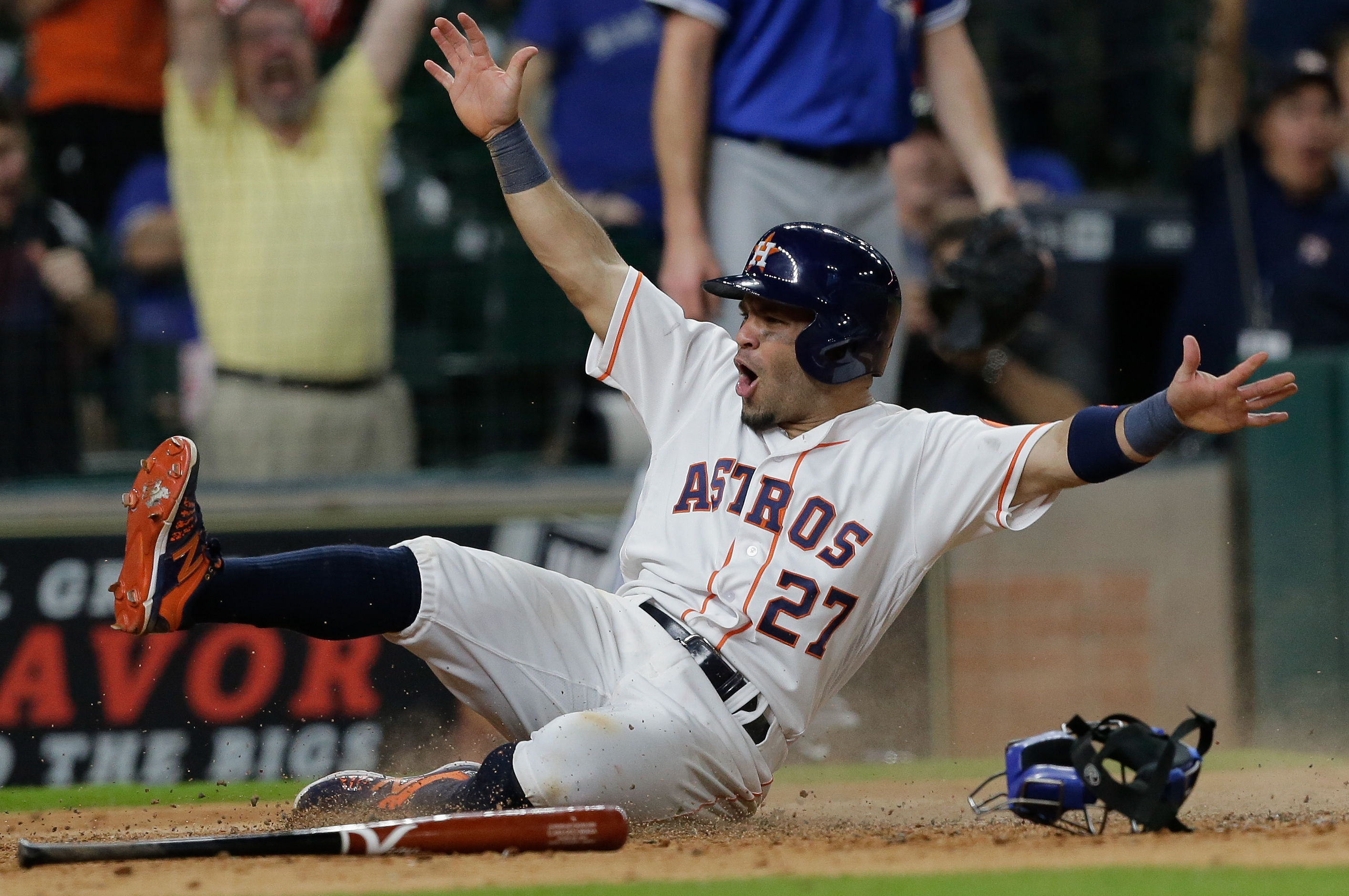 Houston Astros' Jose Altuve (R) walks with Los Angeles Angels Mike