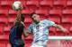Argentina's Jonathan Calleri, right, and Honduras' Jhonatan Paz go for a header during a Group D match of the men's Olympic football tournament between Argentina and Honduras at the National Stadium, in Brasilia, Brazil, Wednesday, Aug. 10, 2016. (AP Photo/Eraldo Peres)
