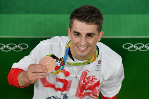 Bronze medallist Britain's Max Whitlock poses with his medal after the men's individual all-around final of the Artistic Gymnastics at the Olympic Arena during the Rio 2016 Olympic Games in Rio de Janeiro on August 10, 2016. / AFP / Ben STANSALL        (Photo credit should read BEN STANSALL/AFP/Getty Images)
