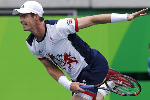 Andy Murray, of England, serves to Viktor Troicki, of Serbia, at the 2016 Summer Olympics in Rio de Janeiro, Brazil, Sunday, Aug. 7, 2016. (AP Photo/Charles Krupa)