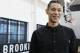 Brooklyn Nets newly acquired guard Jeremy Lin smiles during an interview following a press conference to introduce the team's new players Wednesday, July 20, 2016, in New York. (AP Photo/Kathy Willens)