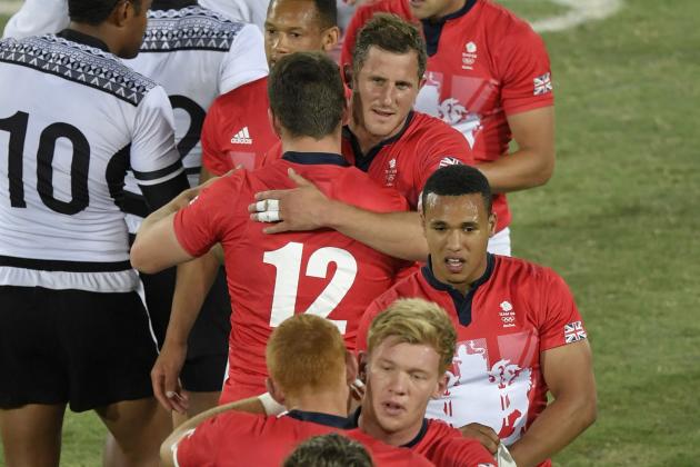 Fiji's (white) and Britain's players shake hands after the mens rugby sevens gold medal match between Fiji and Britain during the Rio 2016 Olympic Games at Deodoro Stadium in Rio de Janeiro on August 11, 2016. / AFP / PHILIPPE LOPEZ        (Photo credit should read PHILIPPE LOPEZ/AFP/Getty Images)