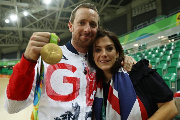 RIO DE JANEIRO, BRAZIL - AUGUST 12: Gold medalist Bradley Wiggins of Team Great Britain and his wife Catherine pose for photographs after at the medal ceremony for the Men's Team Pursuit Final for Gold on Day 7 of the Rio 2016 Olympic Games at the Rio Olympic Velodrome on August 12, 2016 in Rio de Janeiro, Brazil. (Photo by Bryn Lennon/Getty Images)