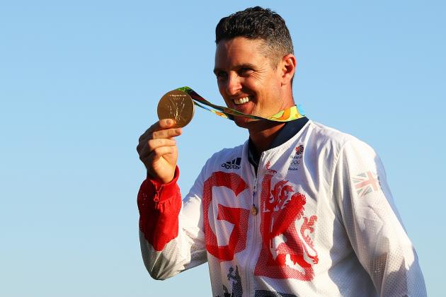 RIO DE JANEIRO, BRAZIL - AUGUST 14: Justin Rose of Great Britain celebrates with the gold medal after winning in the final round of men's golf on Day 9 of the Rio 2016 Olympic Games at the Olympic Golf Course on August 14, 2016 in Rio de Janeiro, Brazil. (Photo by Scott Halleran/Getty Images)