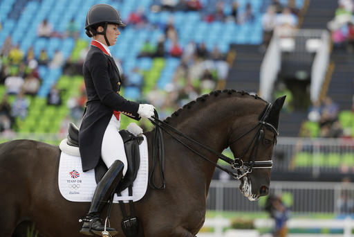 Britain's Charlotte Dujardin, riding Valegro, competes in the equestrian dressage competition at the 2016 Summer Olympics in Rio de Janeiro, Brazil, Friday, Aug. 12, 2016. (AP Photo/John Locher)