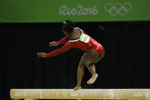 United States' Simone Biles stumbles during her performance on the balance beam during the artistic gymnastics women's apparatus final at the 2016 Summer Olympics in Rio de Janeiro, Brazil, Monday, Aug. 15, 2016. (AP Photo/Dmitri Lovetsky)